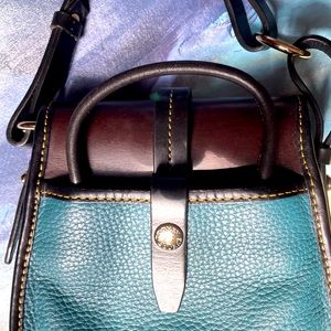Downey and Burke 9”x 7”x 3” blue black strap and brown mini saddle bag lightly w
